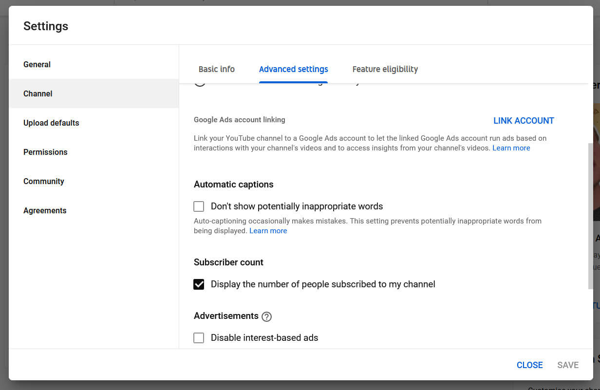 The YouTube Settings dialog showing the option for hiding inappropriate automatic captions